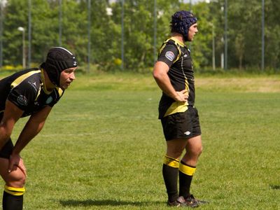 What is the purpose of rugby headgear?