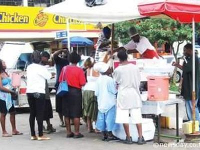 The picture below shows a doubles vendor,the type of business can be classified as: