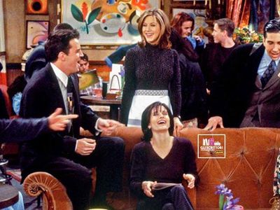 Which artist's songs did Phoebe perform at Central Perk?