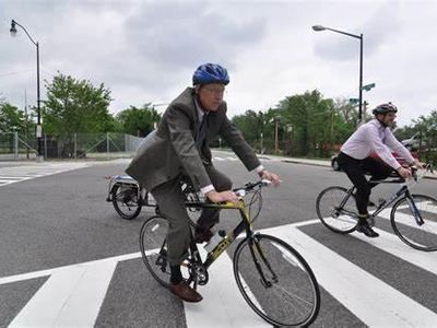 Which of the following is NOT a recommended way to share the road with cyclists?