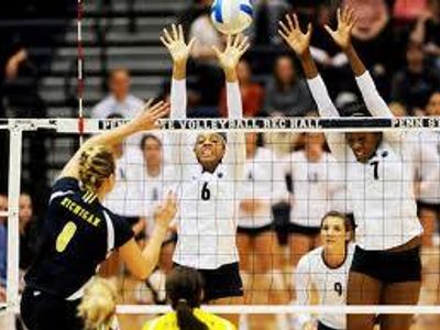 If your blocking the other teams hitter, can your hand touch the net?