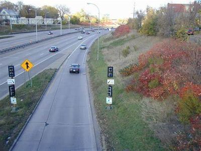 What is the purpose of ramp meters on highway entrance ramps?