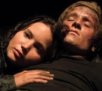 In catching fire what did peeta say to katniss that she couldnt quite catch before she dranged under by morphling