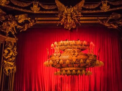 Which theater is famous for its grand chandelier and phantom?