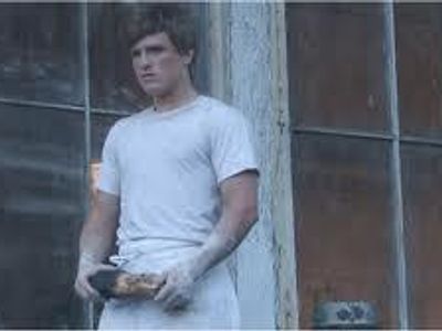 What month did Peeta give Katniss the bread?