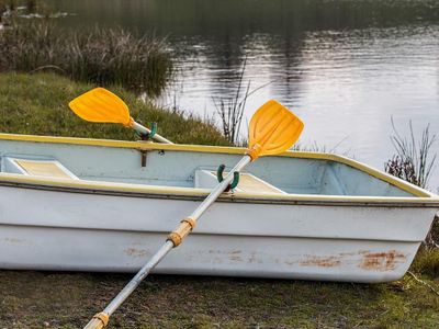 What tool is used to steer a rowboat?