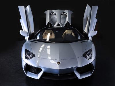 Which luxury car brand produces the Huracan and Aventador models?