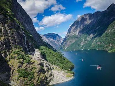 Which mountain range is known for its stunning fjords in Norway?