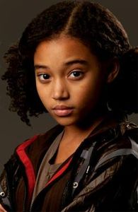 when rue died katniss put _______ in rues hands