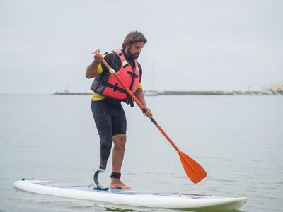 What is the purpose of the leash commonly used with paddleboards?