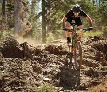 Which country is home to the famous Downieville Downhill trail?