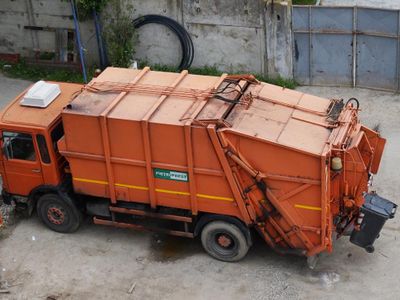 Which type of truck is used for carrying garbage and waste materials?