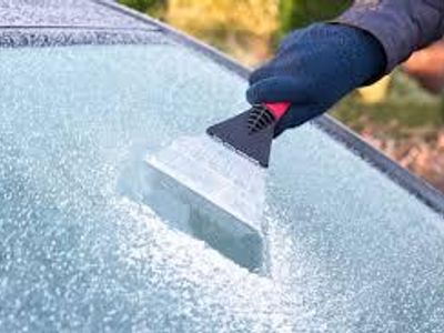 What should you use to clear your windshield during snow?