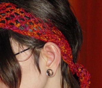 What is the nickname for the wide, hippie-style headbands popular in the 1970s?