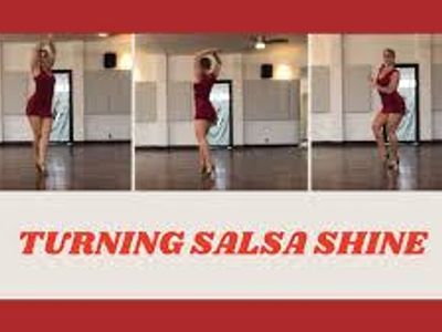 In salsa dancing, what is a 'shine'?