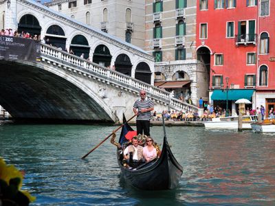 Which city is famous for its canals and gondolas?