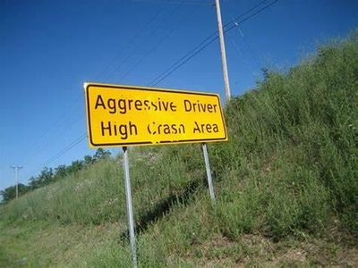 If an aggressive driver is trying to start a fight, you should...