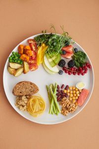 What is the recommended daily serving of fruits and vegetables for adults?