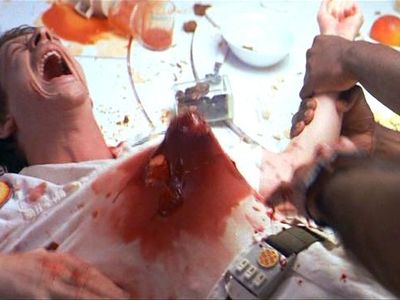 In the 70s movie, "Alien", who is the character in the film whose stomach is ripped open by a bloodthirsty alien in the classic scene?