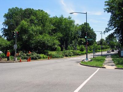 What should you do when approaching an intersection with a non-functioning traffic light?