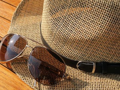 Which term refers to sunglasses that darken in sunlight?