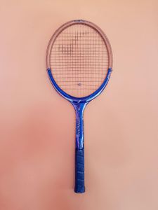 What is the purpose of the backhand grip in Badminton?