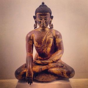 What does the term 'Buddha' mean?