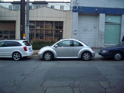 At what distance should you park parallel to the curb?