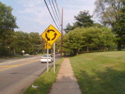 What should you do when approaching a roundabout?