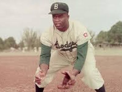 In what year did Jackie Robinson break the baseball color line?