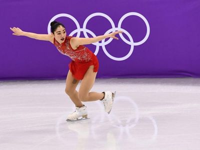 Which American figure skater is the first woman to land a triple axel in competition?