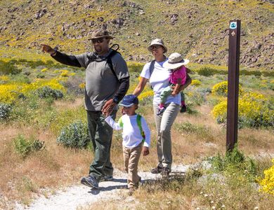 Which trail offers a scenic ride along the coast of California?