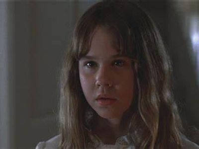 Which horror movie features a possessed child named Regan?