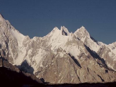 Which mountain range forms a natural border between Europe and Asia?