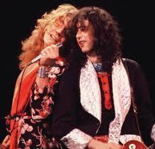 Which classic rock band featured guitarist Jimmy Page and singer Robert Plant?