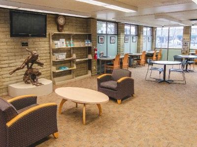 the library, at the tables in the hall