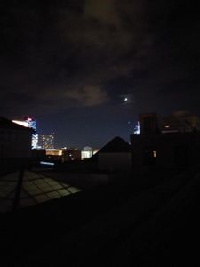 Moon and mars above the city