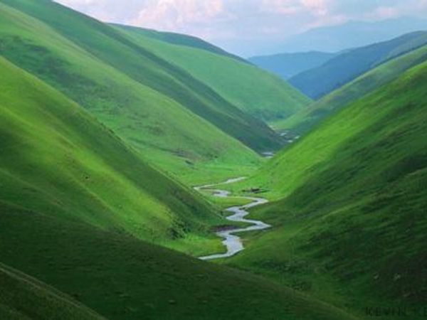 what land form is this? It is a low lying area between 2 mountains or hills.