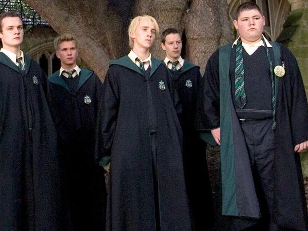 You are walking through a corridor and see a kid who you don't know being bullied by Slytherins. What do you do?