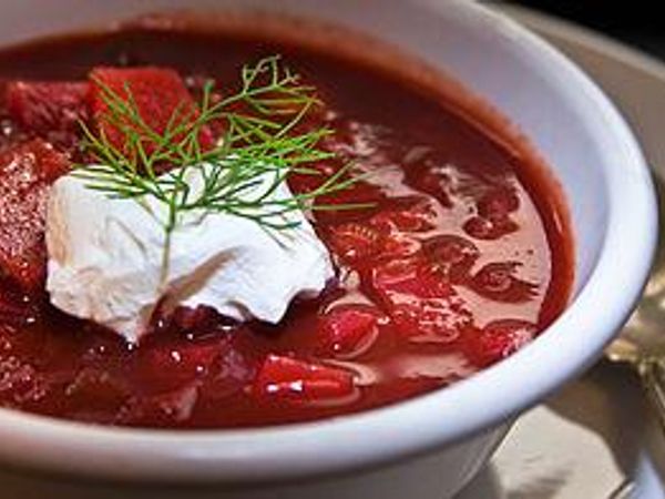 “Borscht is a sour soup commonly consumed in Eastern Europe and across Russia. The variety most often associated with the name in English is of Ukrainian origin, and includes beetroots as one of the main ingredients, which gives the dish its distinctive red color. It shares the name, however, with a wide selection of sour-tasting soups without beetroots, such as sorrel-based green borscht, rye-based white borscht and cabbage borscht.” Wikipedia.   Would you eat borscht?