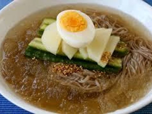 Naengmyeon or raengmyŏn is a Korean noodle dish of long and thin handmade noodles made from the flour and starch of various ingredients, including buckwheat, potatoes, sweet potatoes, arrowroot starch, and kudzu. Buckwheat predominates." Wikipedia.