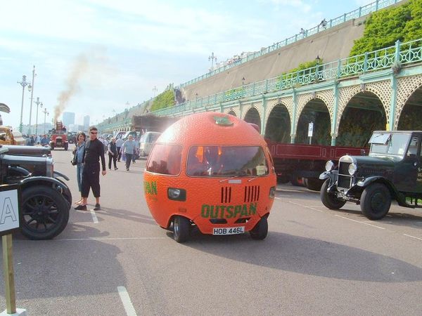 Which orange vehicle would you like to own?