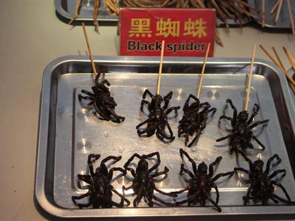 "Fried spider is a regional delicacy in Cambodia. In the Cambodian town of Skuon, the vending of fried spiders as a specialty snack is a popular attraction for tourists passing through this town." Wikipedia.  However, these are also consumed in China.