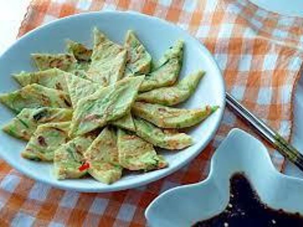 "Buchimgae, or Korean pancake, refers broadly to any type of pan-fried ingredients soaked in egg or a batter mixed with other ingredients."  Wikipedia.