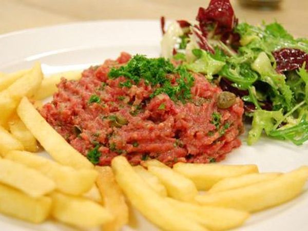 Filet Americain Do you know those foods that try to be authentically based on another country? There's this. It's a spread of overly processed raw beef. Dipping sauce. The french had more to do with it, but people in Holland eat it. There is one question critics have about this filet. "Is it safe to eat?" -Its raw and processed beef.