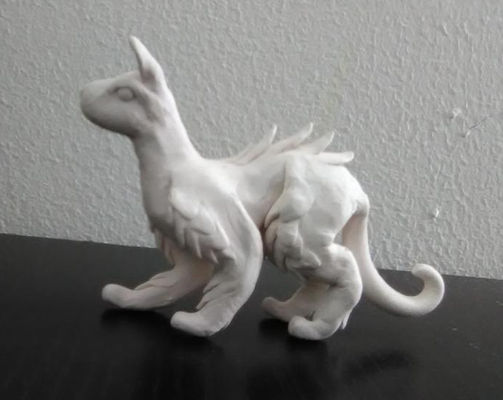 Hey any color suggestions for this sculpture? I made this dog, cat, dragon thing and I don't know what colors to paint it (And yes I know the face is a little, just a little screwed up).