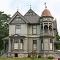 a big Victorian house on the country side