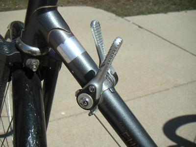 What is the name of the system consisting of the shifters, derailleurs, and chainrings on a road bike?