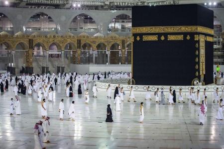 How many times do pilgrims walk around the Kaaba during Tawaf?