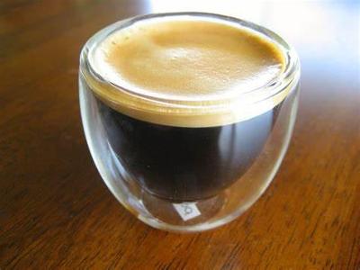 What is the crema on top of an espresso shot composed of?